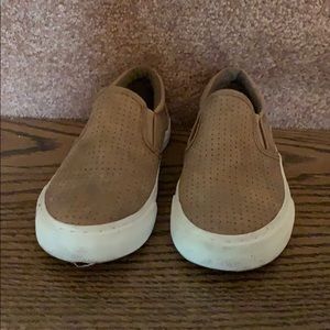 Children place suede slip on sneaker